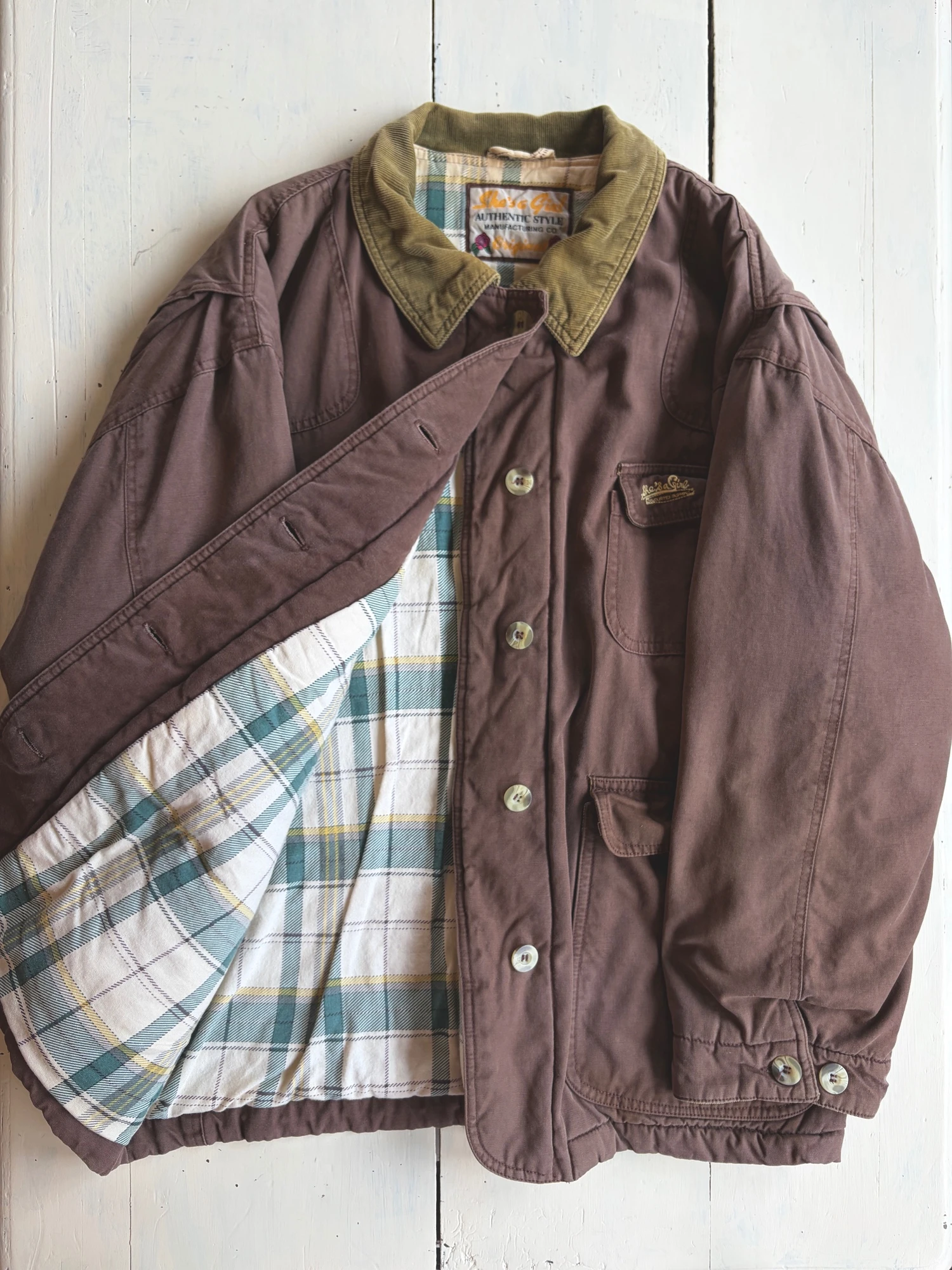 She's a girl brown hunting  jacket