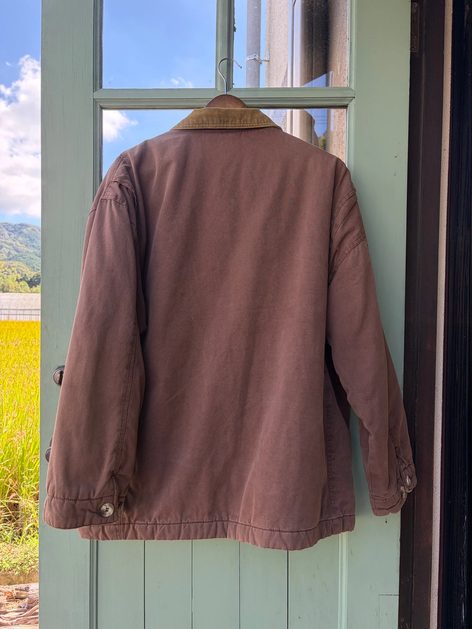 She's a girl brown hunting  jacket 10