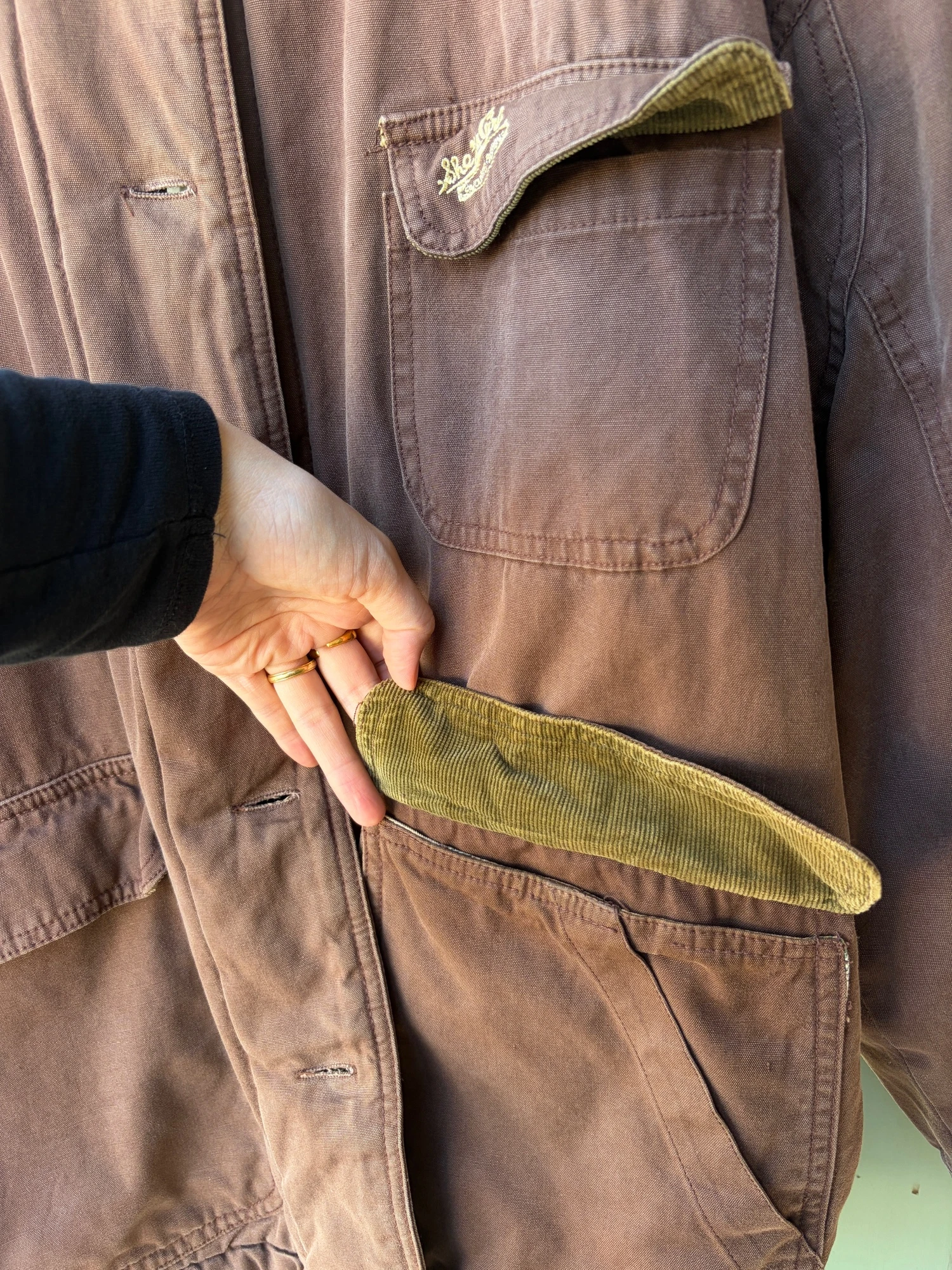 She's a girl brown hunting  jacket 12